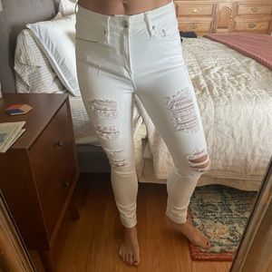 Good American “Good Legs” white distressed jeans